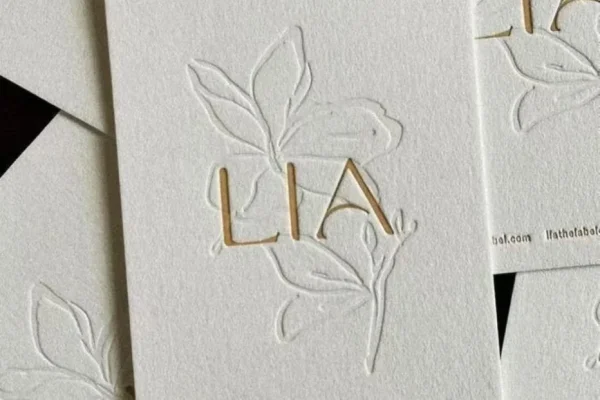 Business Cards — embossed business card #1083 Embossed business card with floral design for luxury branding.