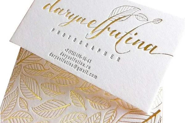 Business Cards — business card #1087 Luxury business card with gold foil and embossed leaf design for a photographer.