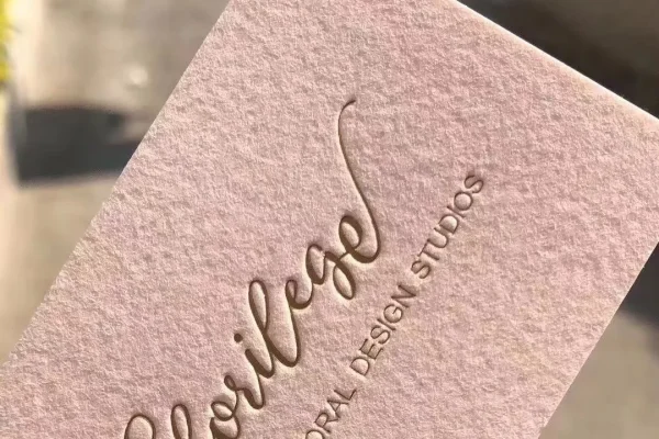 Business Cards — embossed business card #1095 Embossed business card with floral design, showcasing luxury printing.
