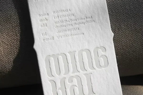 Business Cards — embossed business card #1208 Embossed business card with custom logo and contact details.