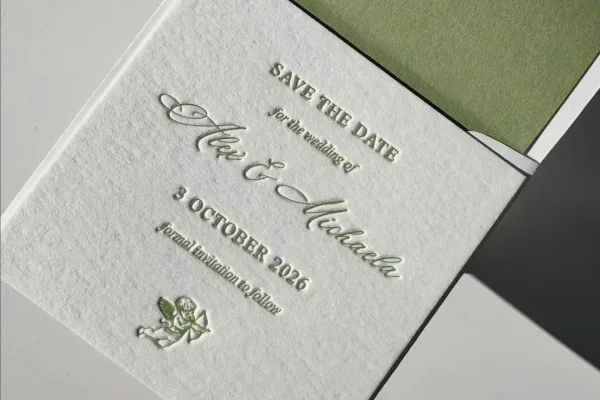 Business Cards — wedding invitation #1228 Wedding invitation card with embossed text and green envelope.
