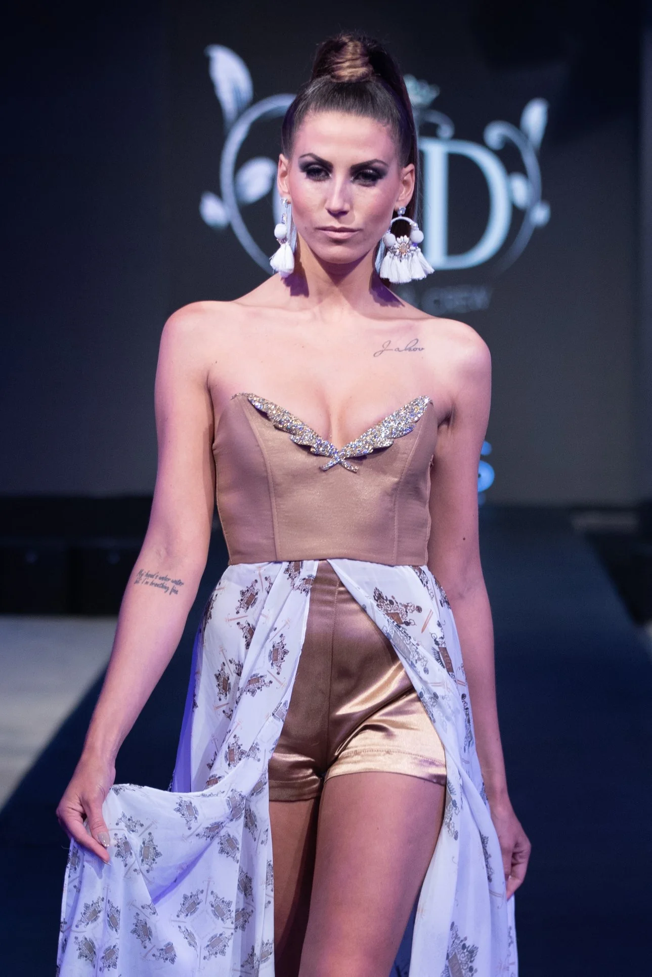 Model wearing custom fashion fabric on runway, showcasing custom fabric printing.