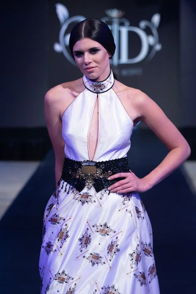 Model wearing a dress with custom printed fabric, showcasing fashion fabric printing.
