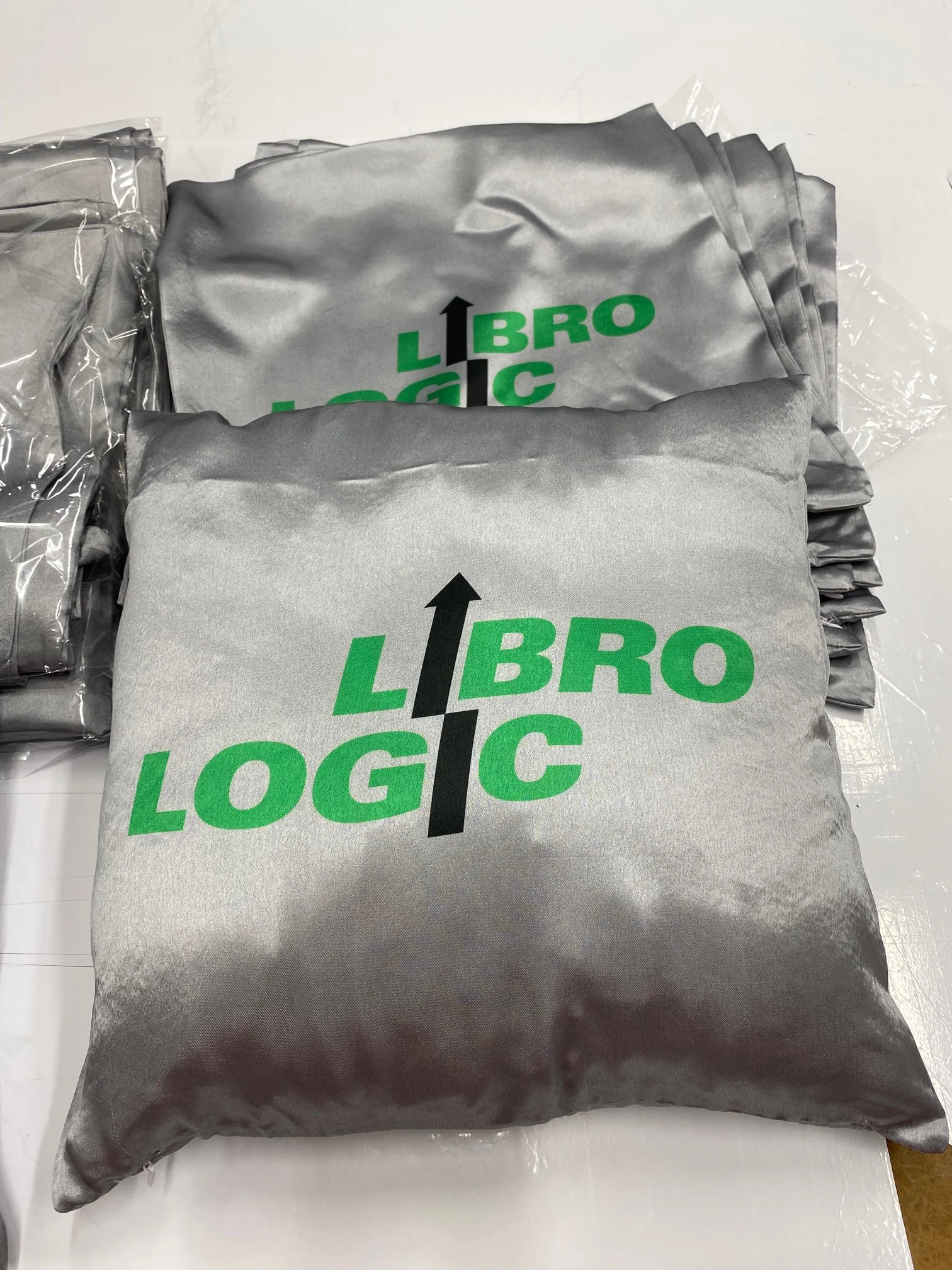 Custom fabric printing on a cushion with a logo design.