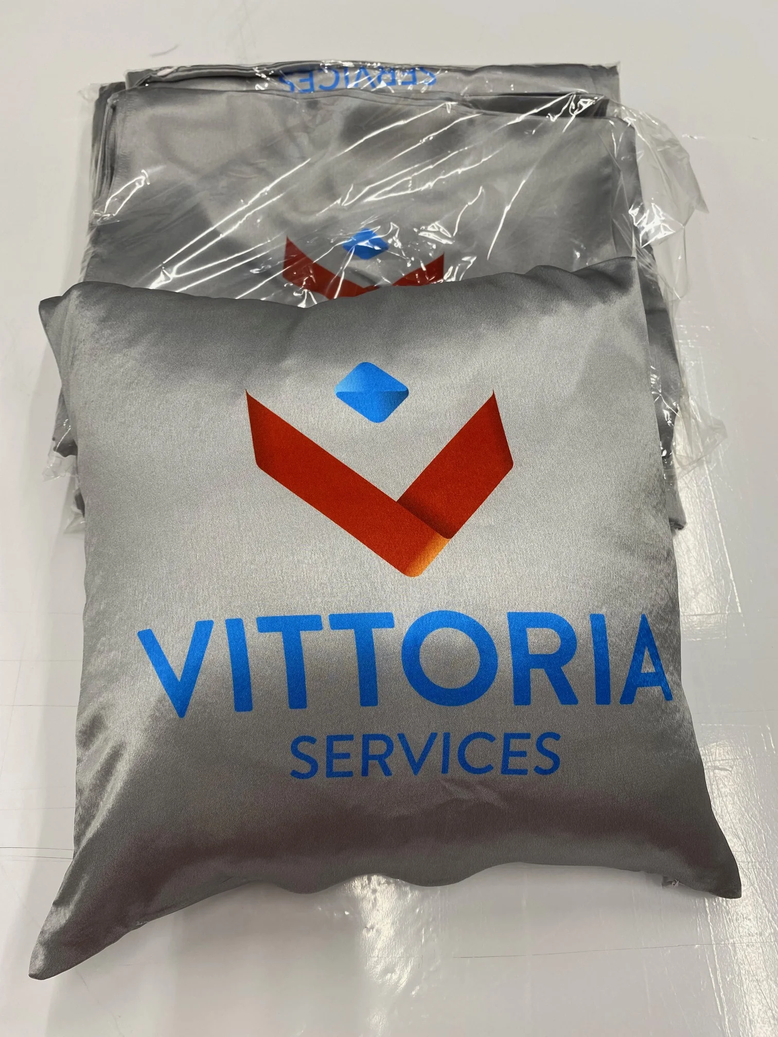 Custom fabric printed cushion with logo and text.