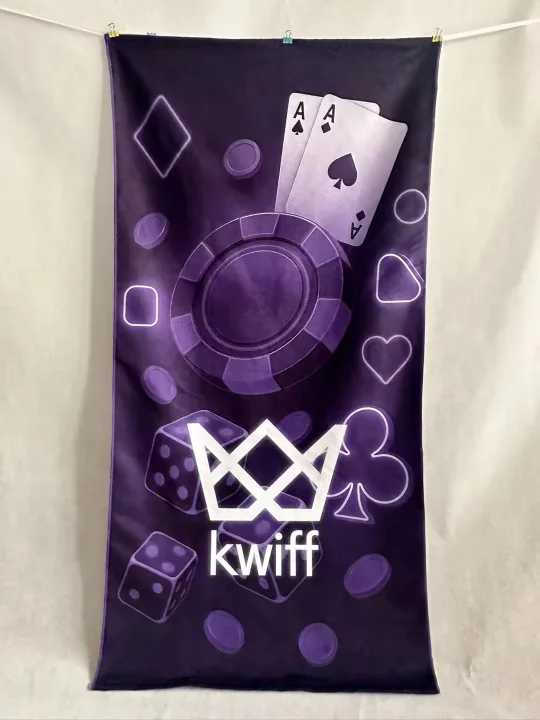 Custom towel with poker-themed design and 'kwiff' logo.