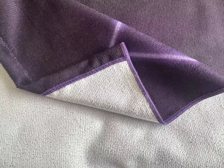 Custom towel with purple and white design, showcasing custom towel printing service.