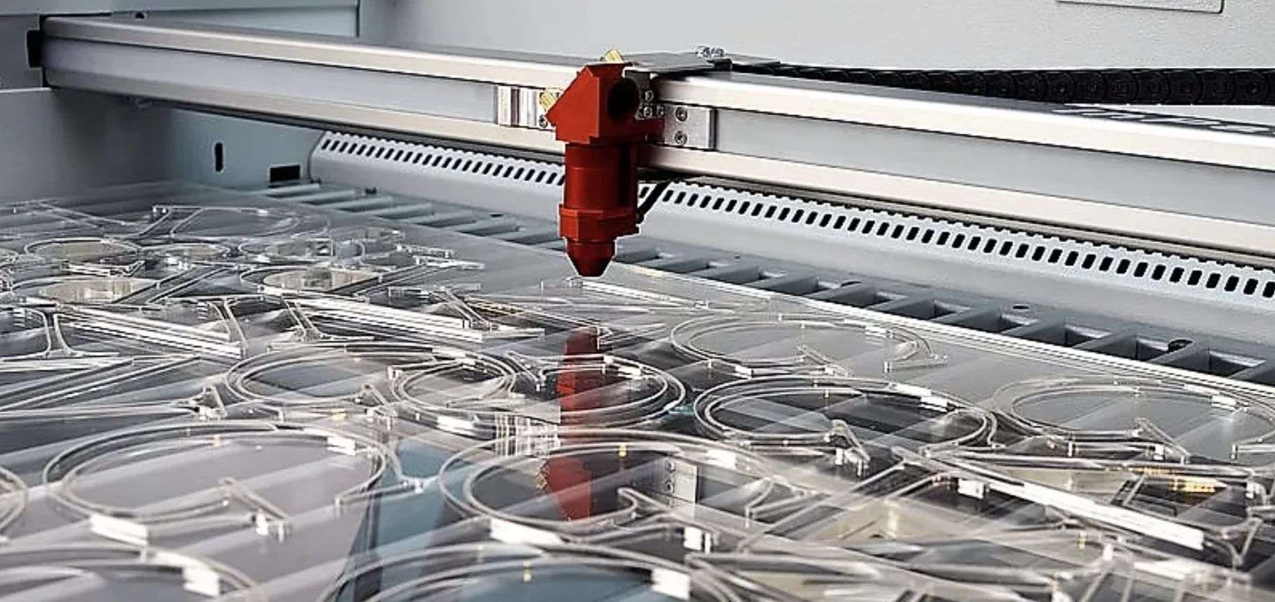 Laser cutting acrylic sheets for precise designs.