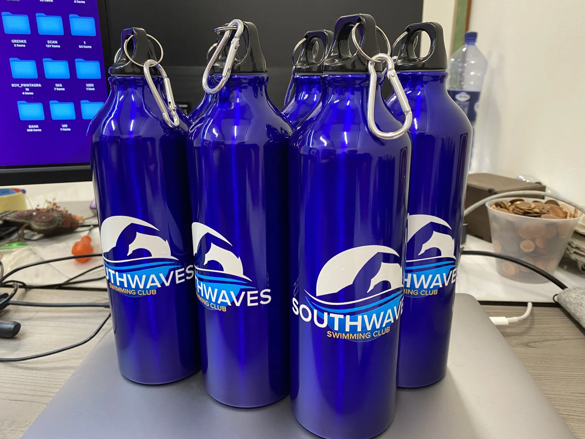 Blue aluminium sports bottle with printed swimming club logo and carabiner.