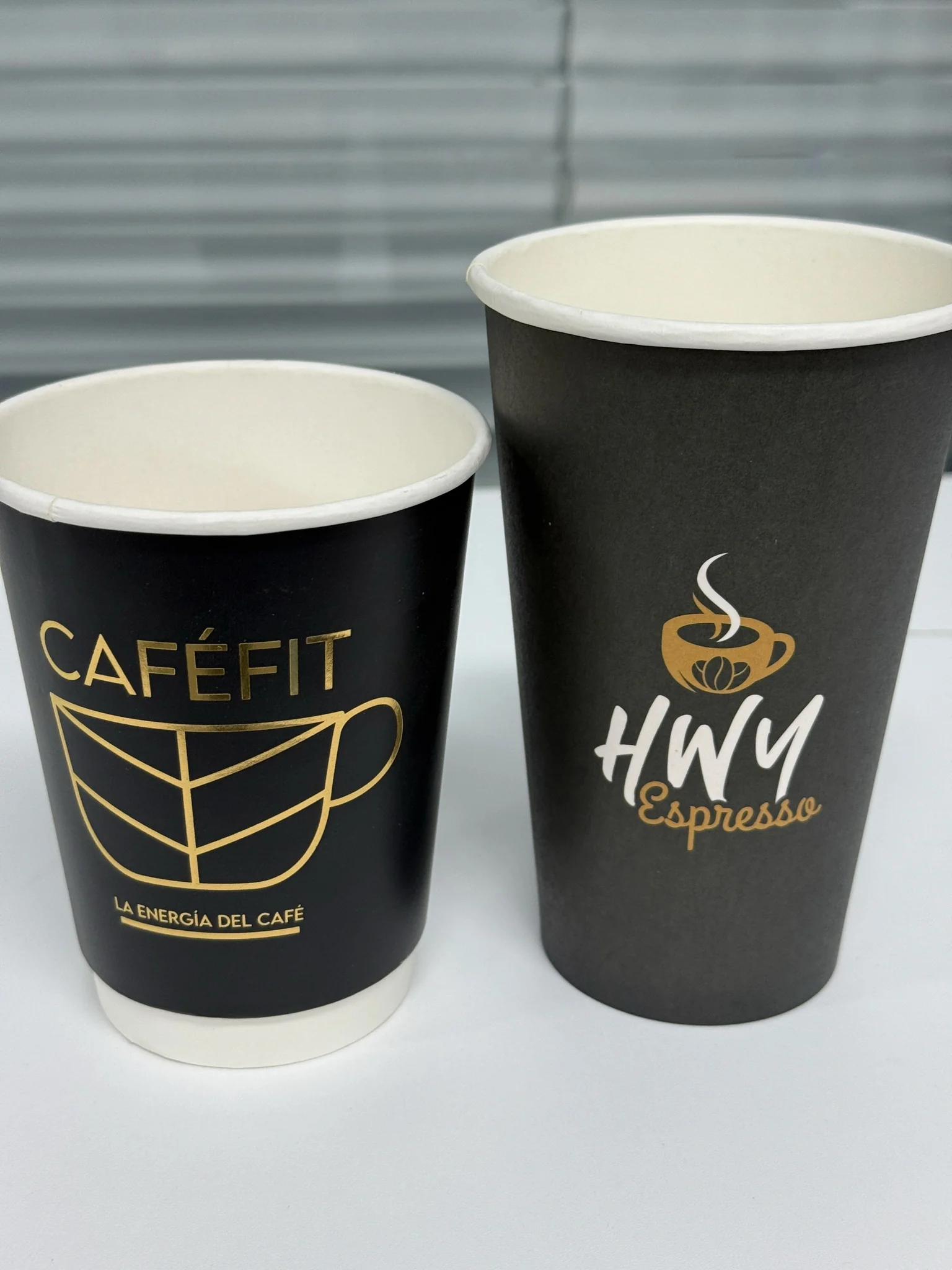 Branded takeaway coffee cups printed for CafeFit and HWY Espresso.
